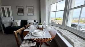 Dining - Stylish 2-bed seaview apartment in Ramsgate’s Royal Harbour. Sleeps 4, with private garage parking. Enjoy coastal walks, cafes, and stunning sunrise and sunsets from your own retreat — perfect for couples, families, or a relaxing seaside escape. (Kent)