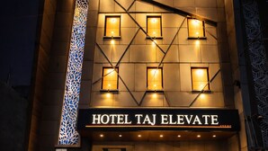 A modern building with a sign reading "HOTEL TAJ ELEVATE." - Hotel Taj Elevate (Agra)