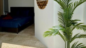 A bedroom with a bed, a wall-mounted air conditioner, and a ceiling fan. - Top Sea view villa Josephine. Close to Chaweng beach (Koh Samui)