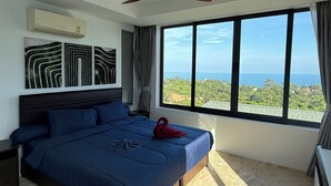 A bedroom with a large bed, a ceiling fan, and a view of the ocean. - Top Sea view villa Josephine. Close to Chaweng beach (Koh Samui)