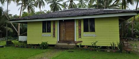 A single-story house with a thatched roof, labeled "Family" and "Bending."