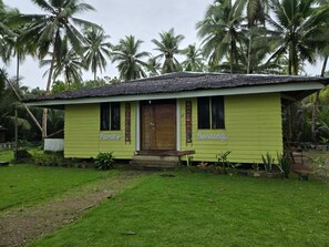 Family Room, Patio, Beach View | Exterior - Cruisers Beach Resort (San Agustin)