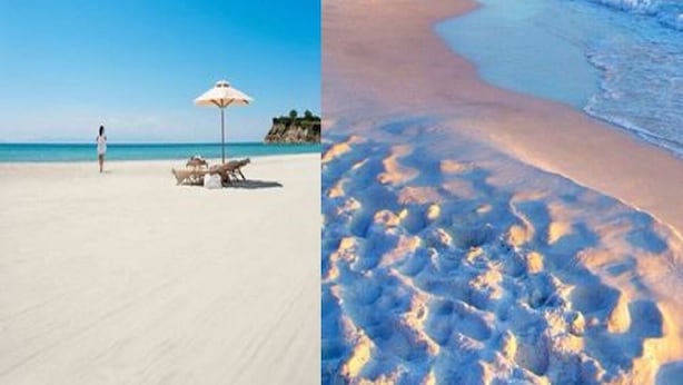 A beach with a clear sky, a person walking, and a beach umbrella. - Casa Blanca a due Passi dal Mare (Ispica)