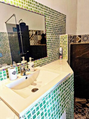 Shower, hair dryer, towels, soap