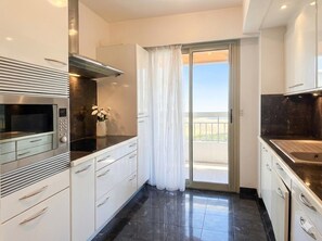 Private kitchen - 1-Bed Apt by Carlton Hotel Large Private Terrace Steps from La Croisette (Cannes)
