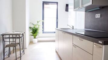 Fridge, microwave, stovetop, coffee/tea maker