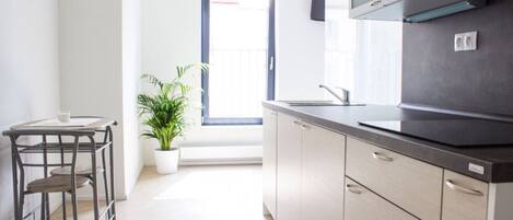 Fridge, microwave, stovetop, coffee/tea maker