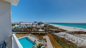 A beachfront hotel with a pool, beach access, and ocean views. - Destin On The Gulf 506 2 Bedroom Condo (Destin)