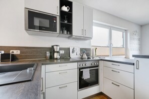 Microwave, dishwasher, coffee/tea maker, toaster