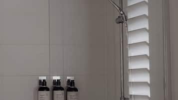 Shower, towels, soap, toilet paper