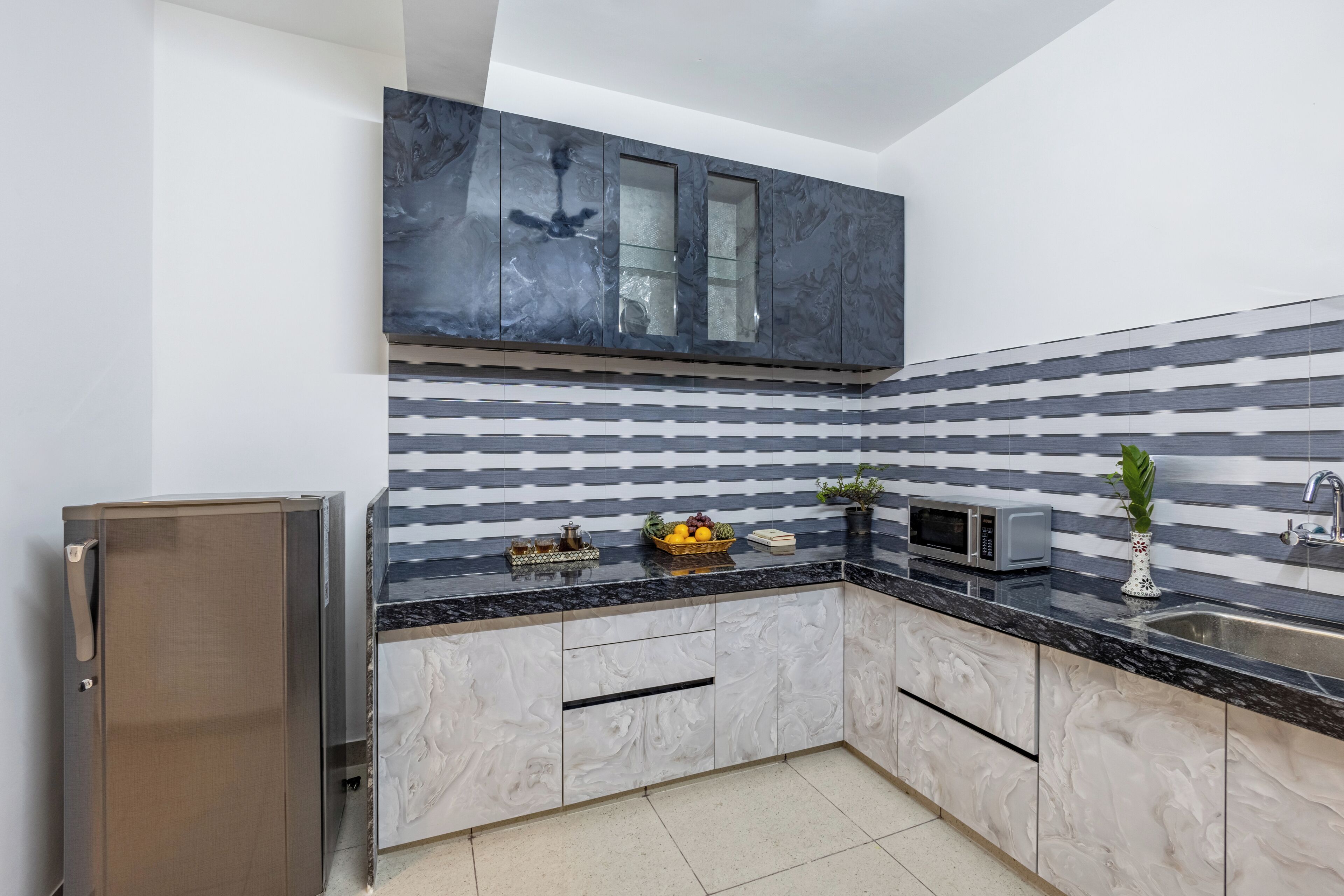 Fridge, microwave, cookware/dishes/utensils, dining tables