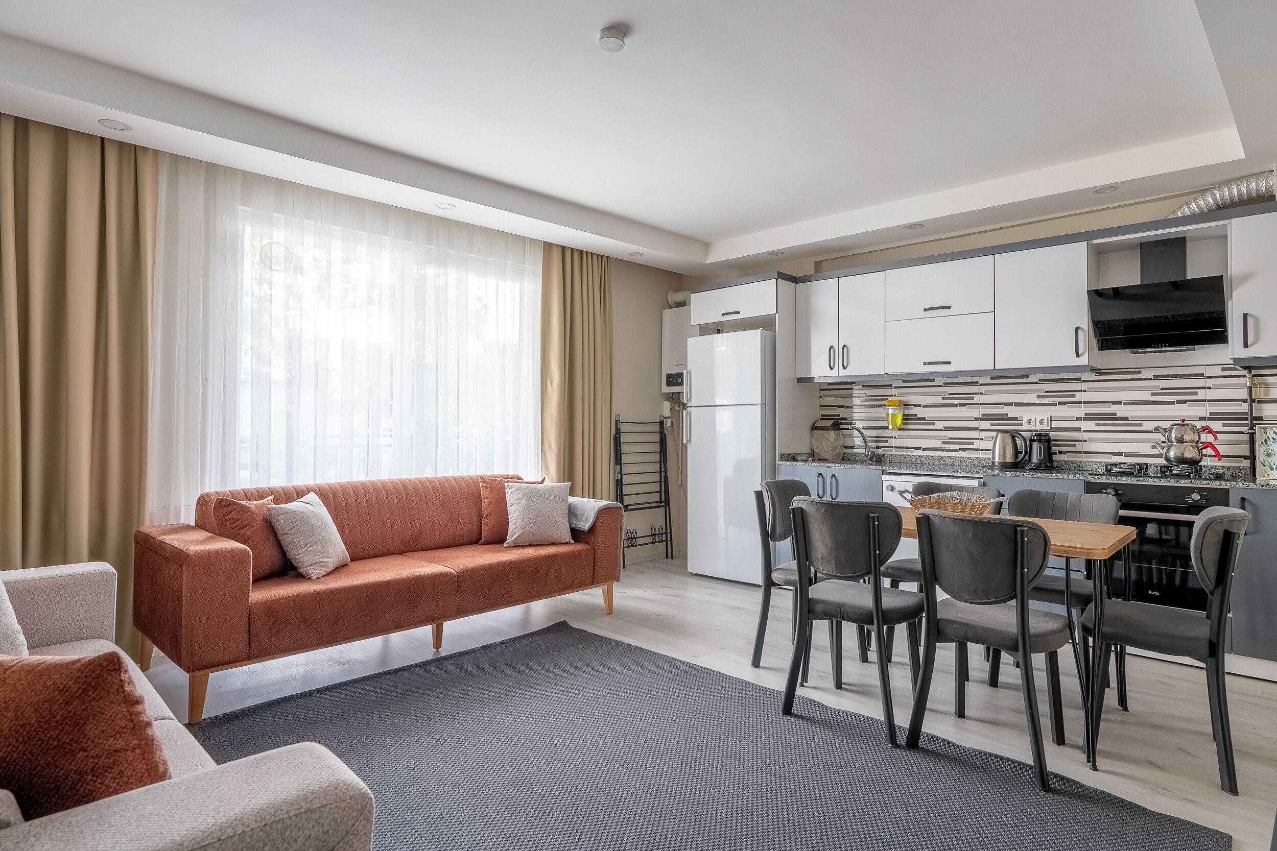 Economy Apartment, 3 Bedrooms, 2 Bathrooms | Living area | 80-cm TV with cable channels