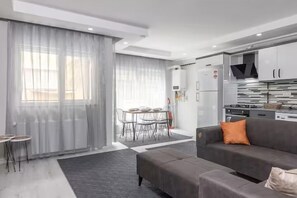 Economy Apartment, 3 Bedrooms, No Windows | Living area | 80-cm TV with cable channels