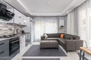 Economy Apartment, 4 Bedrooms, 2 Bathrooms | Living area | 80-cm TV with cable channels - Gokmen Residences (Antalya)