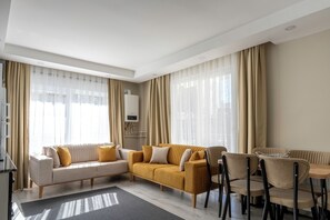 Economy Apartment, 4 Bedrooms, 2 Bathrooms | Living area | 80-cm TV with cable channels - Gokmen Residences (Antalya)