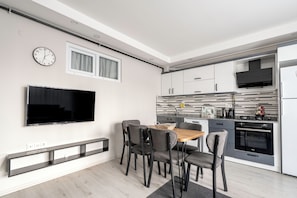 Economy Apartment, 3 Bedrooms, 2 Bathrooms | Living area | 80-cm TV with cable channels - Gokmen Residences (Antalya)