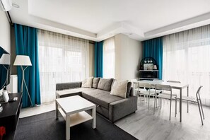 Family Apartment, 2 Bedrooms | Living area | 80-cm TV with cable channels - Gokmen Residences (Antalya)