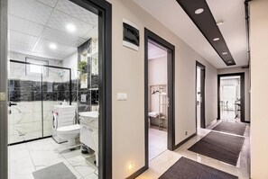 Apartment, 2 Bedrooms | Bathroom | Shower, free toiletries, hair dryer, slippers