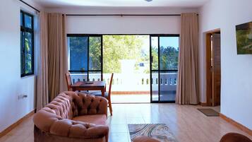 Deluxe Apartment, Balcony, Pool View | Living area