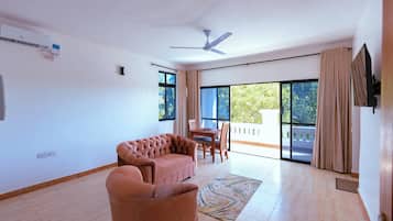 Deluxe Apartment, Balcony, Pool View | Living area | Flat-screen TV