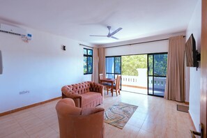 Deluxe Apartment, Balcony, Pool View | Living area | Flat-screen TV - Diani Luxe Spacious B (Diani Beach)