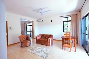 Deluxe Apartment, Balcony, Pool View | Living area | Flat-screen TV - Diani Luxe Spacious B (Diani Beach)