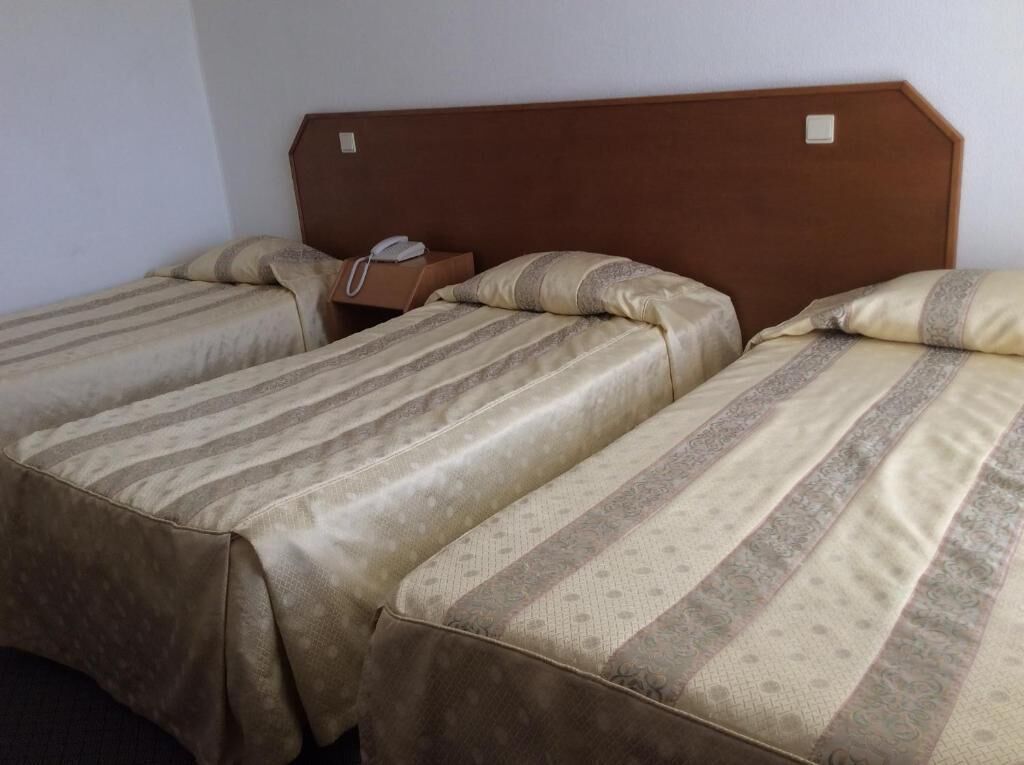 Family Triple Room, Balcony | In-room safe, desk, free WiFi, bed sheets