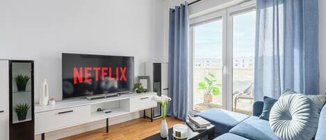 Classic Apartment, Balcony, Courtyard View | Living area | 40-inch LCD TV with digital channels