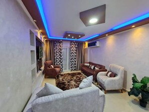 Deluxe Apartment, Balcony, City View | Living area