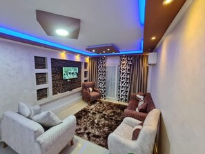 Deluxe Apartment, Balcony, City View | Living area - Movinpick Guest House (Alexandria)