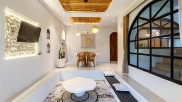 Deluxe Villa, Patio, Pool View | Living area | 32-inch LCD TV with cable channels