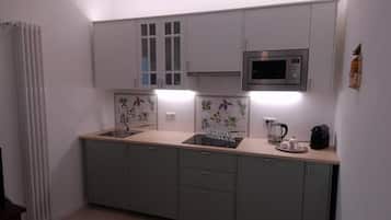 Classic Apartment, Courtyard View | Private kitchen | Espresso maker, coffee/tea maker, electric kettle, dining tables