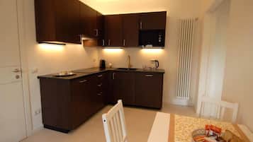 Classic Apartment, Balcony, Tower | Private kitchen | Espresso maker, coffee/tea maker, electric kettle, dining tables