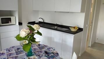 Lägenhet - 1 sovrum - terrass - utsikt mot trädgården | Interiör