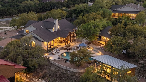 A large house with a swimming pool, outdoor seating, and a covered patio area. - 5BR Hill Country | Casita, Pool + 3-Building Compound | Sleeps 18 (Dripping Springs)