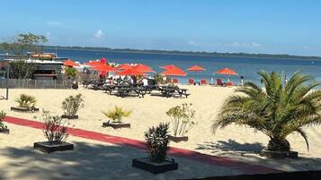 On the beach, sun loungers, beach towels