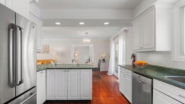 A modern kitchen with white cabinetry, stainless steel appliances, and a central island. - Large Whole Home in Wine Country: Pool Hottub Sauna + Spacious Backyard & Nature (Prince Edward)