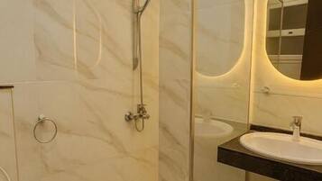 Shower, towels, soap, toilet paper