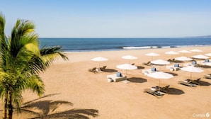 A beach with white umbrellas and lounge chairs arranged in rows. - One Bedroom Suite Grand Mayan, Vidanta's Luxury Beach Resort, VIP Theme Park acc (Nuevo Vallarta)