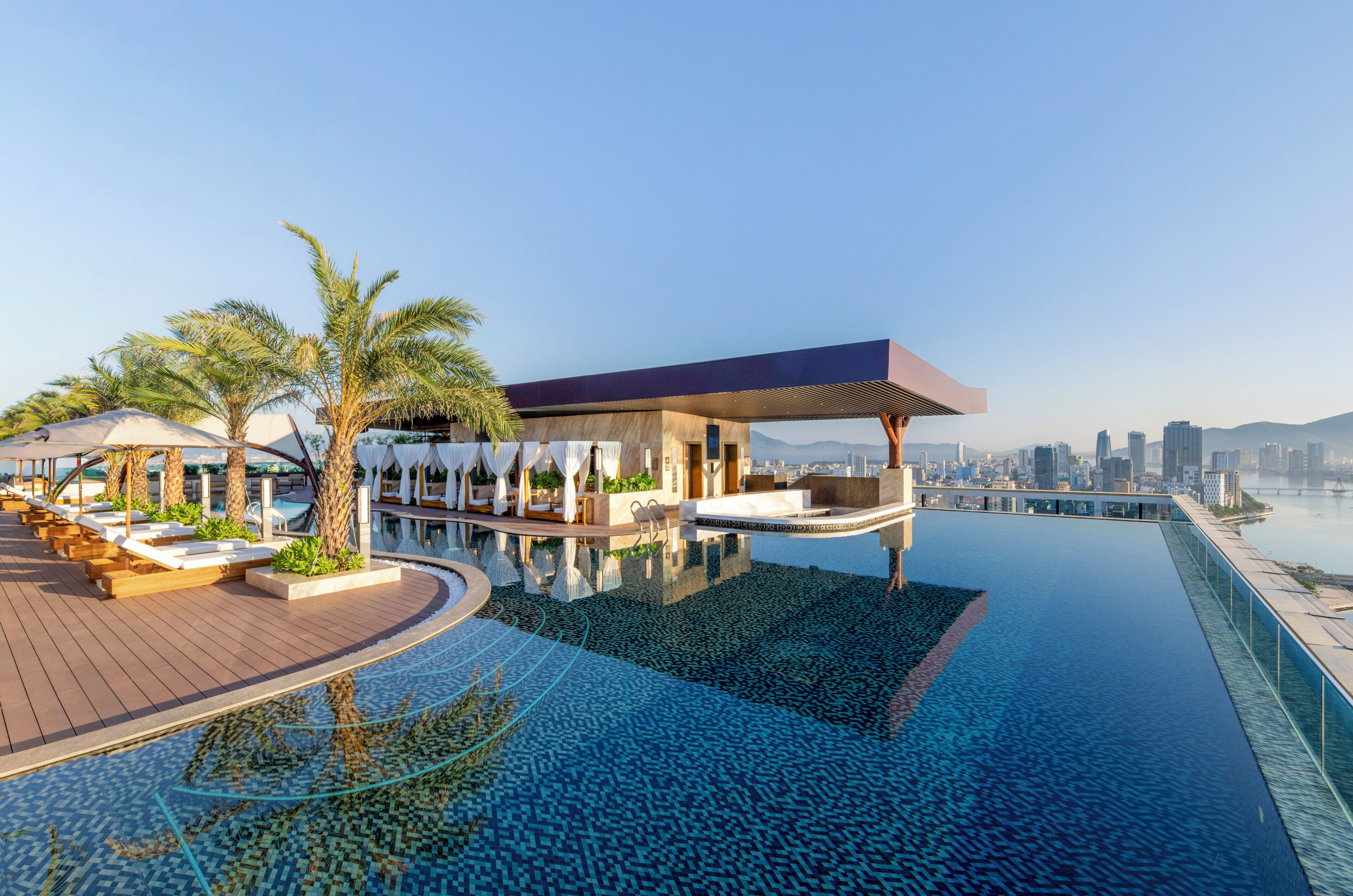 Outdoor pool, open 7:00 AM to 8:00 PM, free cabanas, pool umbrellas