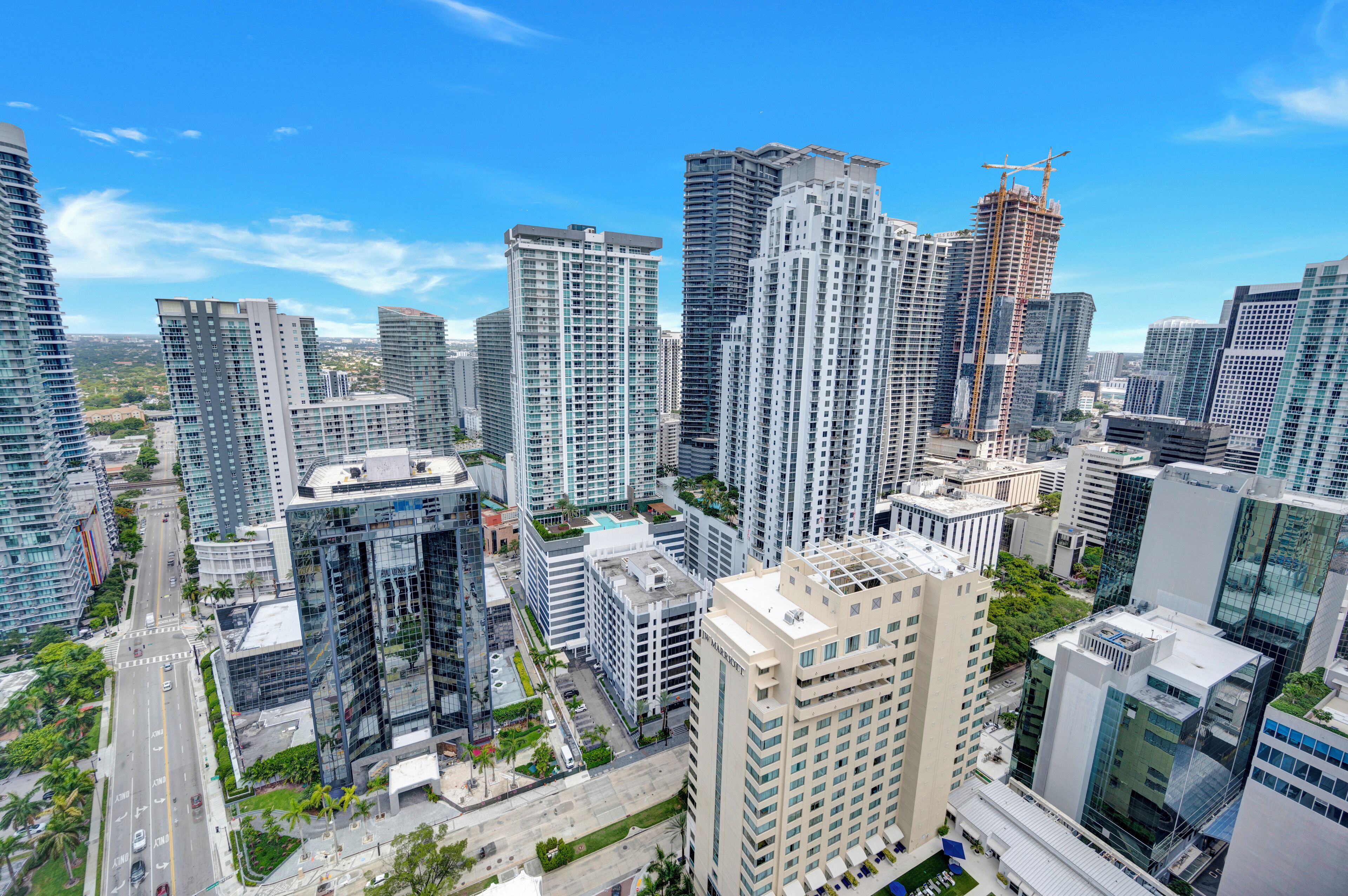 A high-rise urban area with modern buildings, including a construction site.