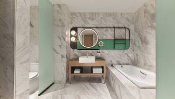 A modern bathroom with a marble floor, a freestanding bathtub, a vanity with a mirror, and a toilet.