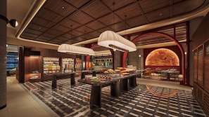 A modern hotel lobby with a check-in counter, seating area, and a large wall mural. - Voco Kuching by IHG (Kuching)