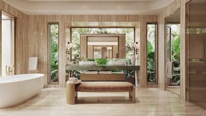 Une salle de bain moderne avec une baignoire sur pieds, un banc et un grand miroir.