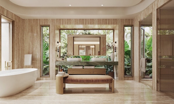 Un baño moderno con una bañera independiente, un banco y un espejo grande.
