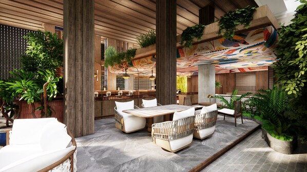 A modern indoor space with a central seating area, wooden columns, and green plants. - Kimpton Suntaya Bali Ubud by IHG (Ubud)