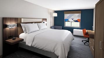 A modern hotel room with a large bed, a desk, and a chair.