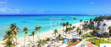 On the beach, sun-loungers, beach towels