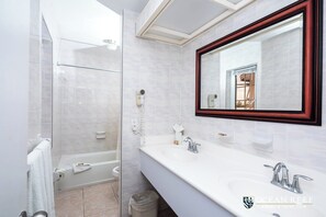 Shower, hair dryer, towels, soap - Three Bedroom Townhouse (Freeport)