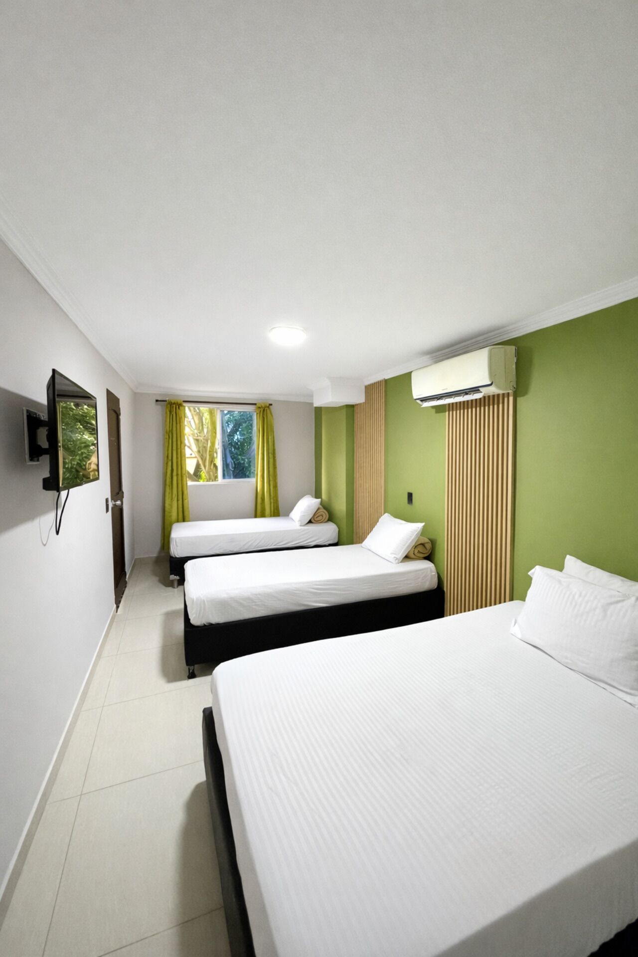 Standard Quadruple Room | Laptop workspace, blackout curtains, iron/ironing board, free WiFi